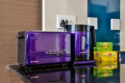 a purple coffee maker sitting on top of a counter at Luxury Sea View apartment in Dubai