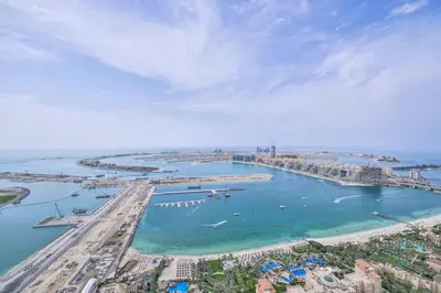 an aerial view of a beach with boats in the water at Luxury Sea View apartment in Dubai