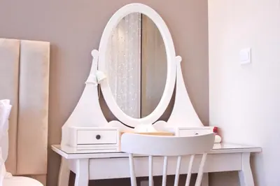 a bathroom with a white vanity and a mirror at Spacious Spectacular Skyline View in Heart of Dubai in Dubai