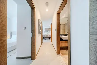 a hallway leading to a bedroom and a living room at 2BR apartment in Missoni in Dubai