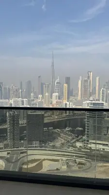 a view of a city skyline from a window at Luxe 3BDR Panoramic Burj Khalifa Views Business Bay in Dubai