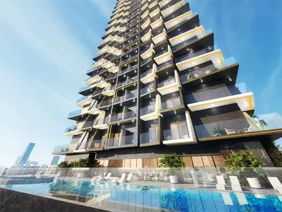 a tall building with a swimming pool in front of it at Luxurious new 1 bedroom with Balcony and New Building in Dubai