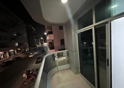 a view of a city street at night from a building at Double Bed Partition Room Near Mashreq Metro in Dubai