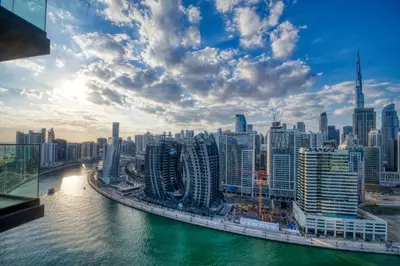 a view of a city with a river and buildings at AWS Holiday Homes - Dreamful Views of the Burj in Dubai