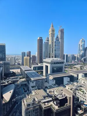 an aerial view of a city with a clock tower at 85m2 En Suite, DIFC in Dubai