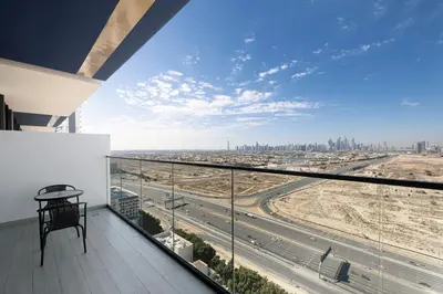 a balcony with a view of a highway at Daniels Stylish 1BR Apartment with Al khail View in Dubai