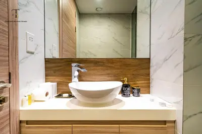 a bathroom with a sink and a mirror at Splendid City Views Studio- SOL BAY Business Bay in Dubai