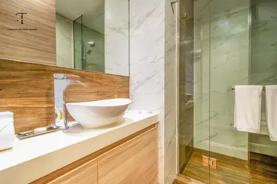 a bathroom with a sink and a glass shower at Splendid City Views Studio- SOL BAY Business Bay in Dubai