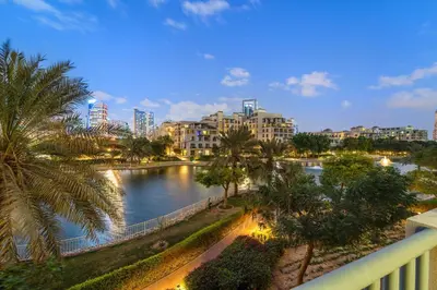 a view of a river in a city with buildings at Cozy Studio with Scenic Canal Views in Dubai