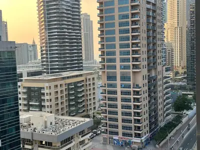 an aerial view of a city with tall buildings at Cozy Studio- Dubai Marina in Dubai