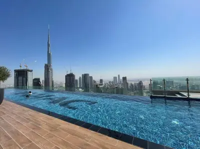 a large swimming pool on top of a building at High Floor , Premium 1 Bedroom , Stunning Views in Dubai