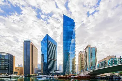 a group of tall skyscrapers in a city at GuestReady - Dubai Marina retreat with balcony in Dubai