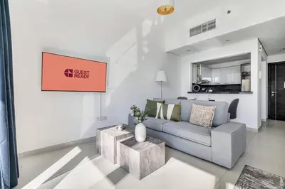a living room with a couch and a table at GuestReady - Dubai Marina retreat with balcony in Dubai