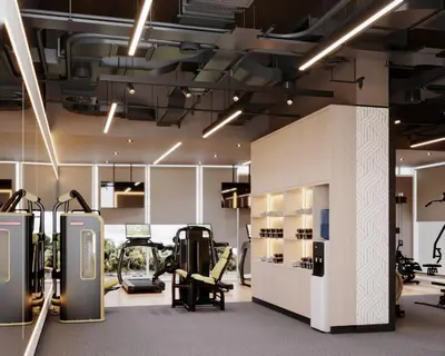 a gym with a treadmill and elliptical machines at Grand Millennium Business Bay in Dubai