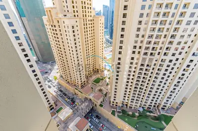 an aerial view of a city with tall buildings at Lovely Studio in Murjan 2, Jumeirah Beach Residence by Deluxe Holiday Homes in Dubai