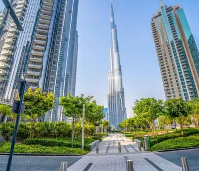 a view of the burj khalifa from a street in a city at Luxury Apartment ACT One Act Two 7 Min Walk to Burj Khalifa & Dubai Mall in Dubai