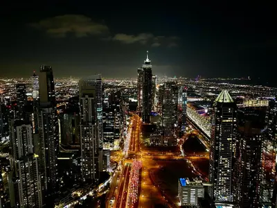 a view of a city at night with traffic at Downtown Skyline & Burj Khalifa Views Dubai in Dubai