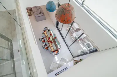 an overhead view of a room with cars on display at Coastal Themed 4BR Townhouse with Pool in JVC in Dubai