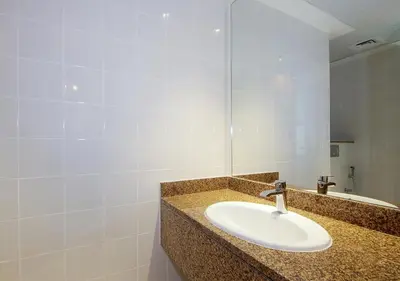a bathroom with a sink and a mirror at Luxury Villa With breathtaking View And Beach Access in Dubai