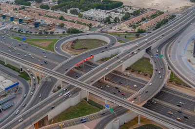 an overhead view of a highway interchange with traffic at Stunning 3BR w Panoramic Views in Aykon City in Dubai