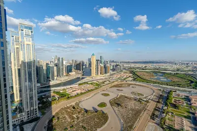 an aerial view of a city with tall buildings at Stunning 3BR w Panoramic Views in Aykon City in Dubai