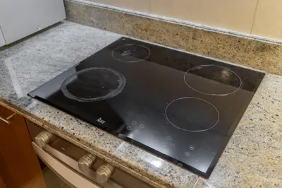 a stove top with circles on it in a kitchen at Sophisticated and Elegant 2BR in Downntown Dubai in Dubai