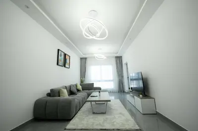 a living room with a couch and a table at Dubai Marina - 1 BHK Unique Apartment in Dubai