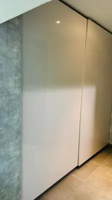 a large white wall in a room with at Elegant Guesthouse in Business Bay in Dubai