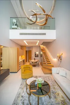 a living room with a couch and a chandelier at Iconic 1Bedroom Duplex with Skyline Views Near Downtown Dubai & Burj Khalifa in Dubai