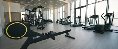 a gym with a bunch of exercise equipment in a room at Iconic 1Bedroom Duplex with Skyline Views Near Downtown Dubai & Burj Khalifa in Dubai