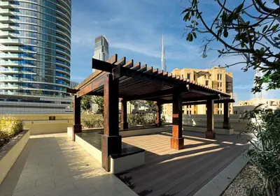 a pavilion on a sidewalk in a city at DreamShoma-1B Spacious Apartment in Dubai