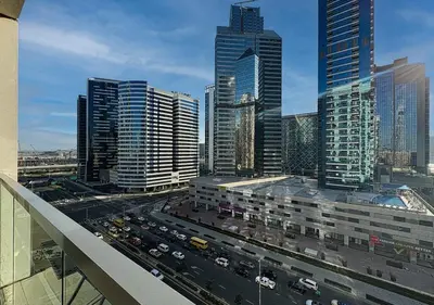 a view of a city with traffic on a highway at DreamShoma-1B Spacious Apartment in Dubai
