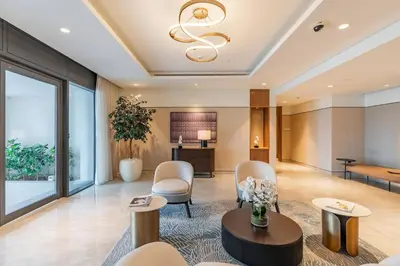 a lobby of a hotel with chairs and a table at BLVD - Steps from Dubai mall and Dancing Fountain in Dubai