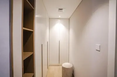 a room with a closet with a stool in it at Sea View l Port De LaMer l Next to Beach l Perfect for 4 in Dubai