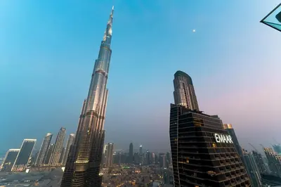 a group of tall buildings in a city at 3BR Family abode with Iconic Burj Khalifa view in Dubai