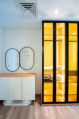 a dressing room with two mirrors and a closet at Modern Studio I Boulevard View I Downtown Dubai in Dubai