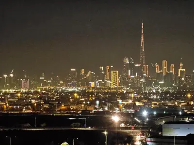 a night view of a city with lights at Dubai Silicon Oasis Staycation in Dubai