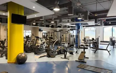 a gym with treadmills and elliptical machines at FIRST CLASS 2BR Breathtaking Beach Views in Dubai