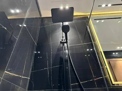 a camera on the wall of a building at Bright 1br Jvc Balcony & Free Parking in Dubai