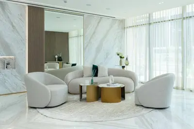 a living room with two chairs and a couch at Comfortable 1br In Jvc Balcony Free Parking in Dubai