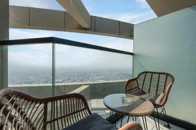a room with two chairs and a table with a view at Aykon City Tower I Birds Eye View in Dubai