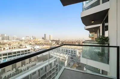 an apartment balcony with a view of a city at Elegant 1 BR in Empire Residence in Dubai