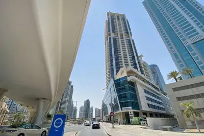 a view of a city street with tall buildings at Silkhaus Comfy 1BR in Botanica Tower near Dubai Marina in Dubai