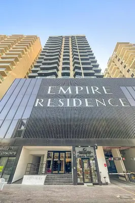 a tall building with the words maimonides center on it at Cozy Studio in Empire Residence in Dubai
