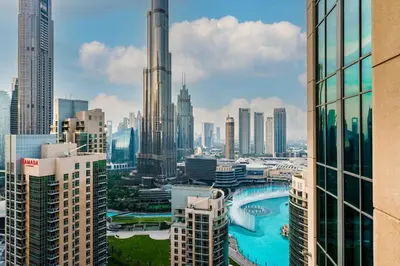 a view of a city skyline with tall buildings at King 1BR Apartment With Burj Khalifa & Fountain View in Dubai