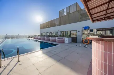 an image of a swimming pool on a building at Mood Living 45 in Dubai