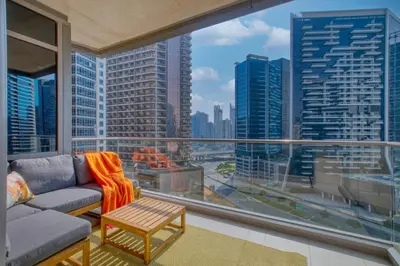 a living room with a view of a city at The Smart Concierge - Southridge 1 in Dubai
