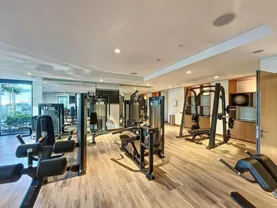 a gym with a lot of treadmills and machines at Vacationer l Marvel Super Hero Themed 3 Bedroom l Dubai Fountain Views in Downtown in Dubai