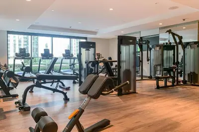 a gym with a lot of exercise equipment in a building at Vacationer l Marvel Super Hero Themed 3 Bedroom l Dubai Fountain Views in Downtown in Dubai