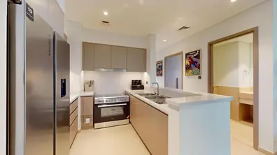 a kitchen with a sink and a stove at Vacationer l Marvel Super Hero Themed 3 Bedroom l Dubai Fountain Views in Downtown in Dubai